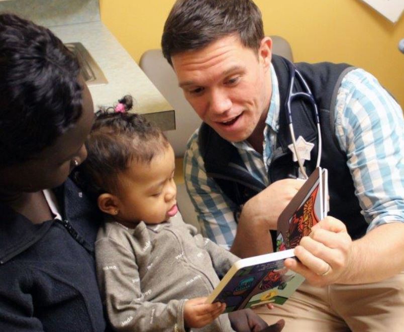 Doctor and child reading